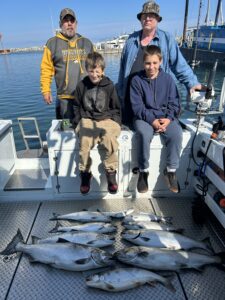 Kids catching fish on their Leland fishing charter trip