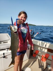 Traverse City fishing charter catch by a kid